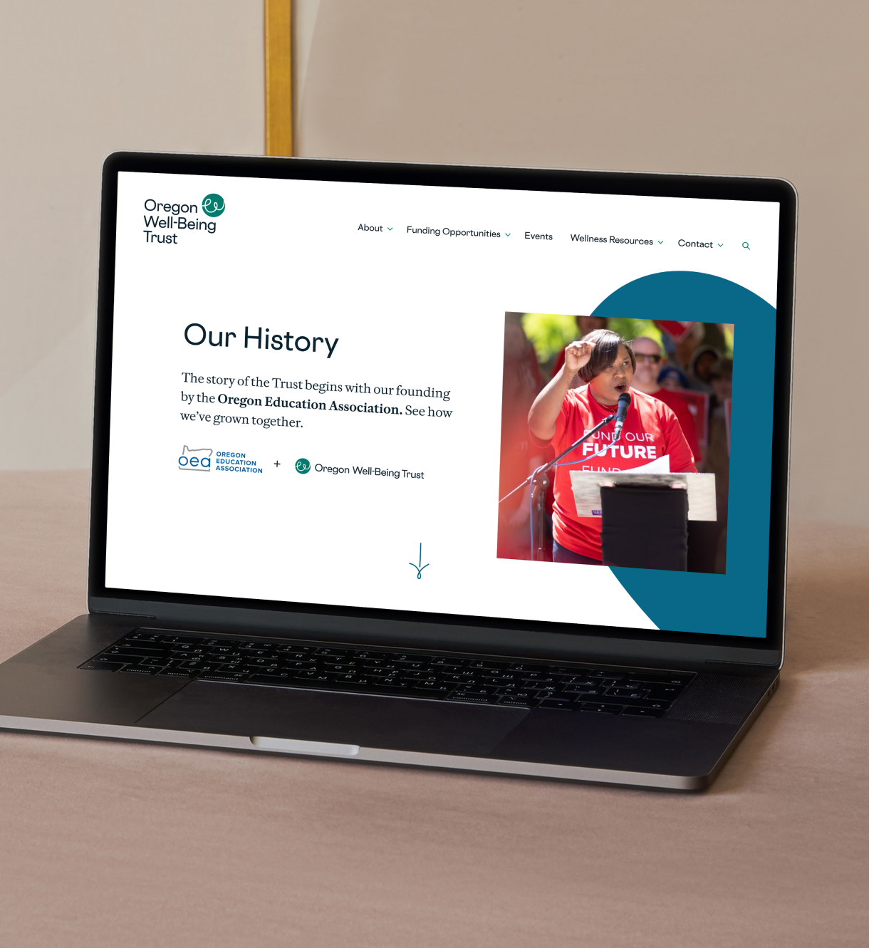 Desktop view of Oregon Well-Being Trust "Our History" page featuring woman speaking at an event.