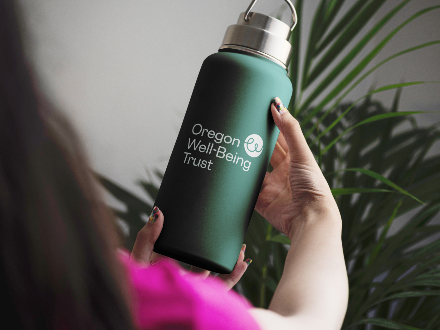 Dark green Oregon Well-Being Trust waterbottle.