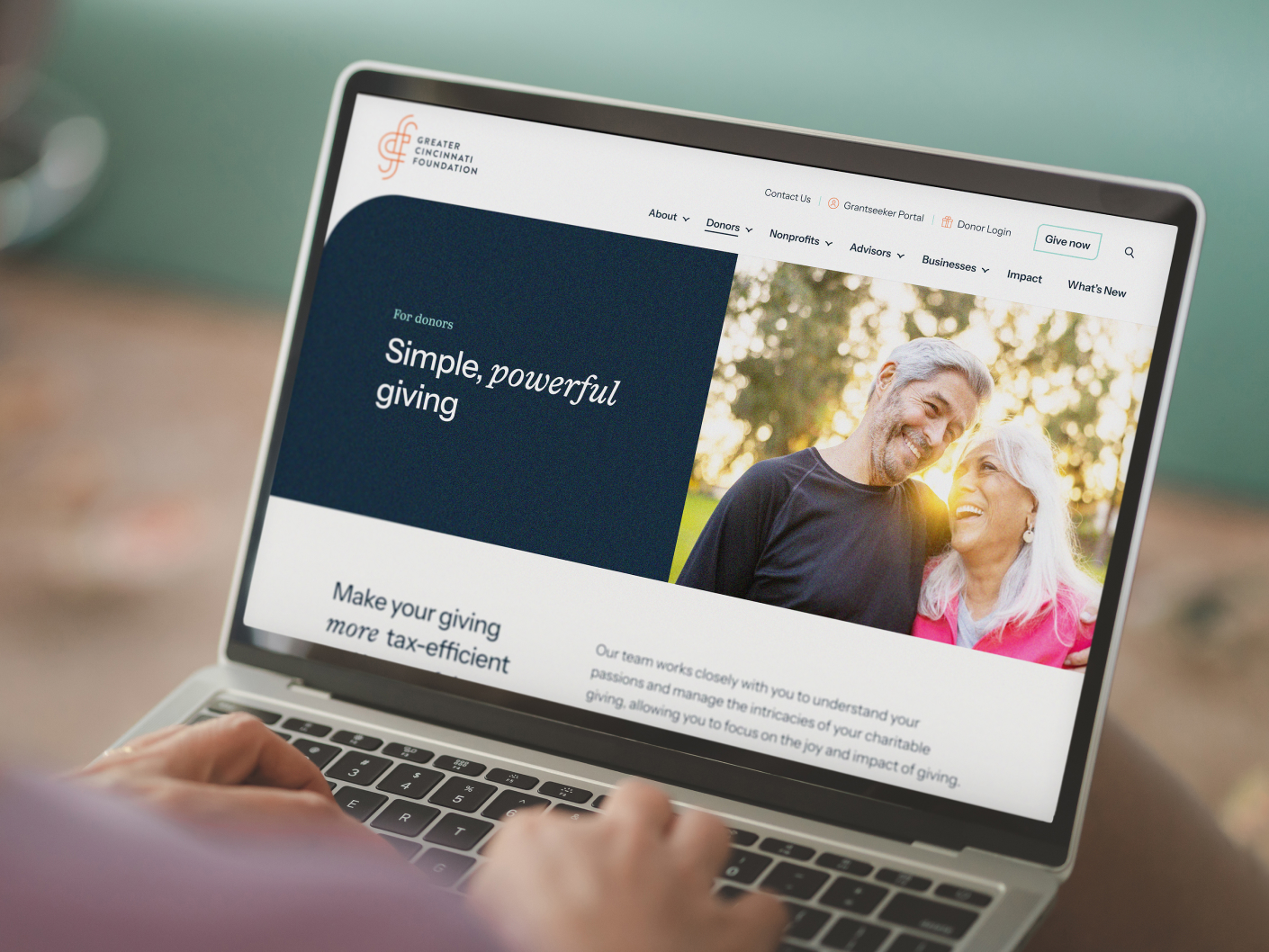 Screenshot of Greater Cincinnati Foundation's homepage with the words "Simple, powerful, giving" and two people smiling.