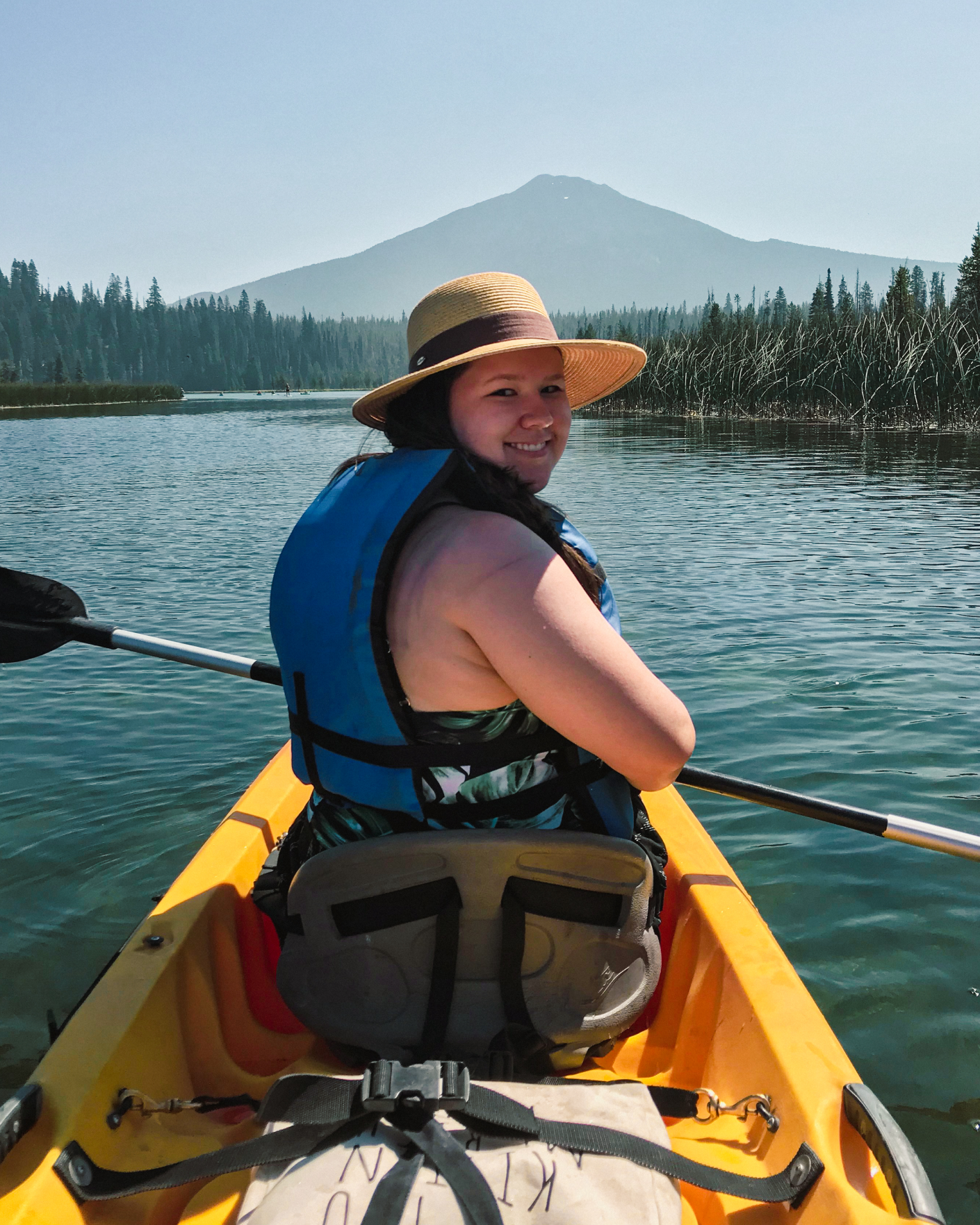 Madison at the front of a kayak, looking back. Very Instagram-pose-worthy. Likely somewhere on the Columbia River, but who knows.