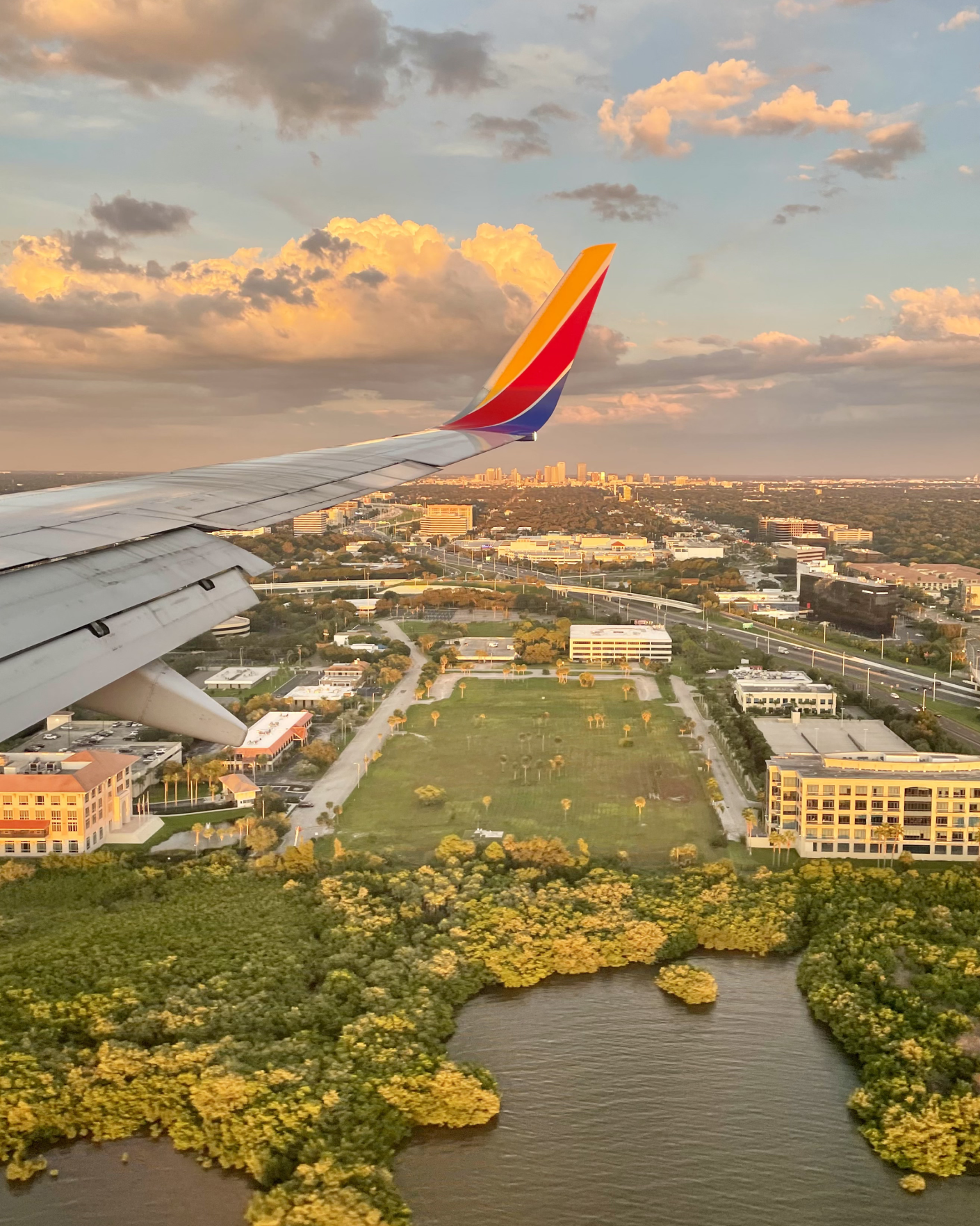 View from airplane window, landing in Tampa at sunset