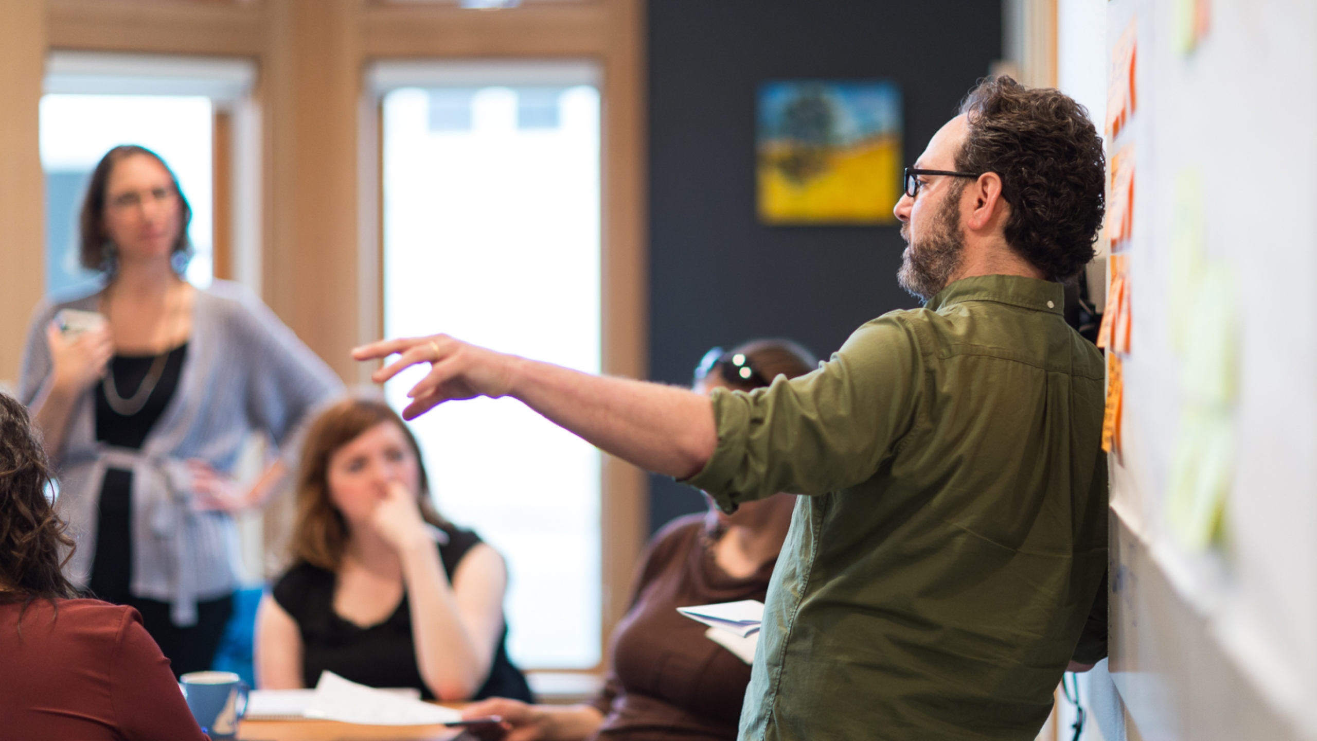 Scott presenting to a small group at an event.