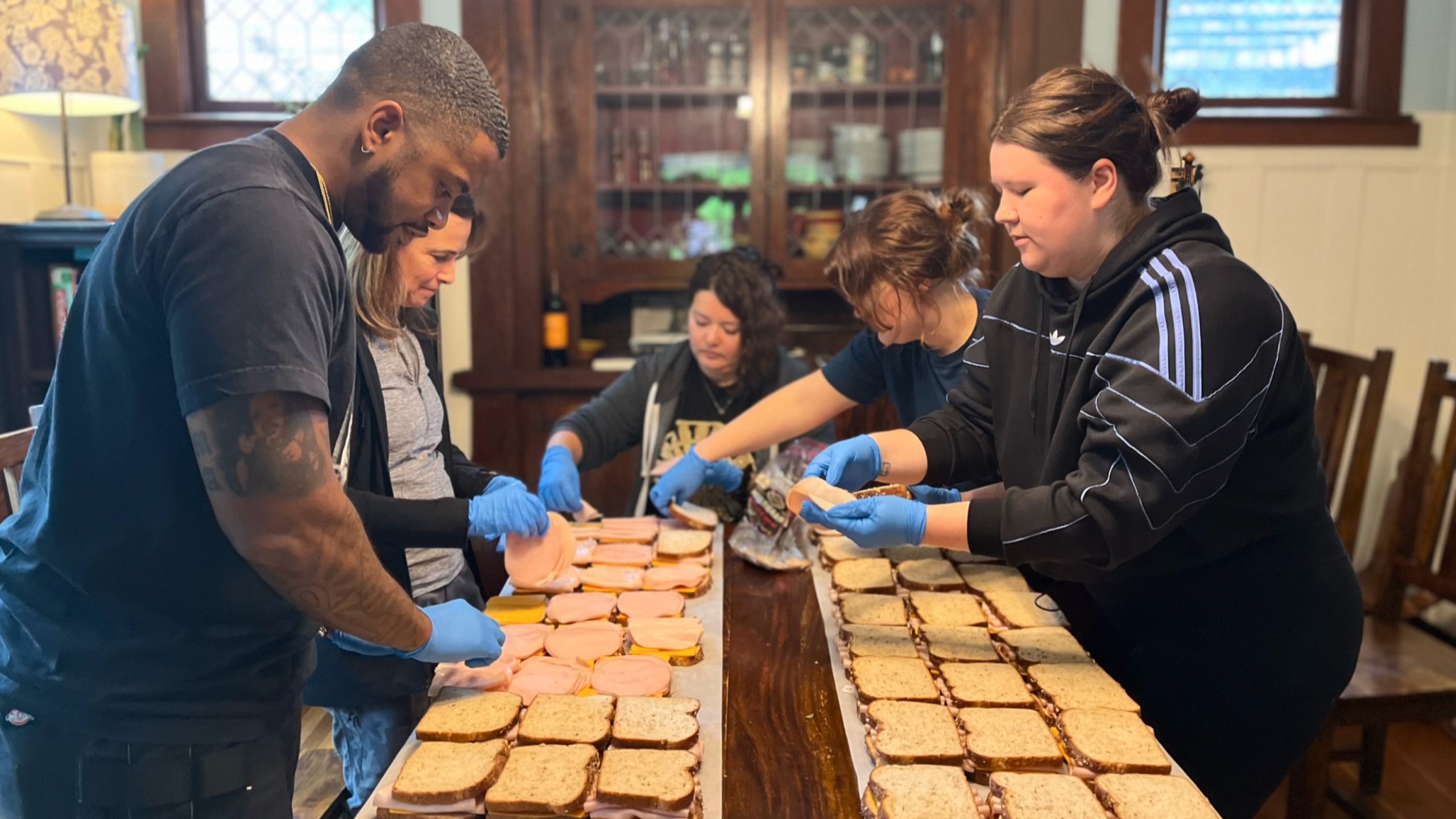 Putting together sandwiches for Blanchet House, a local nonprofit