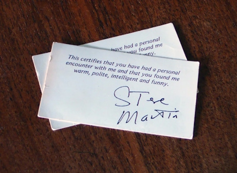 A business card that says This certifies that you have had a personal encounter with me and that you found me warm, polite, intelligent and funny. Signed Steve Martin.