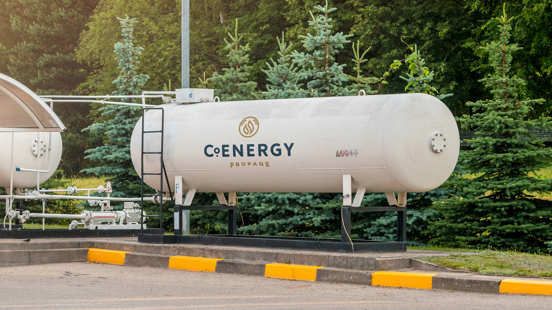 A photograph of a commercial propane tank with the CoEnergy logo painted on.