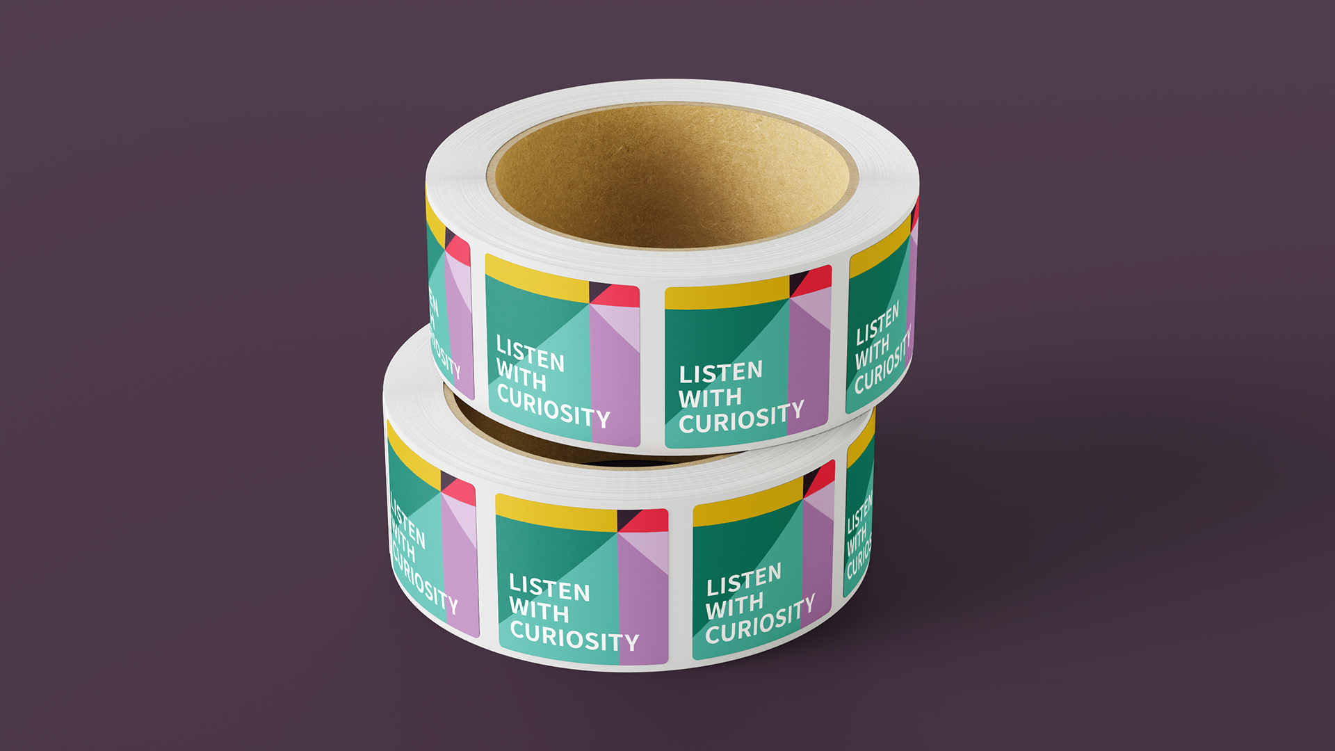 A roll of stickers with the new Hearken brand pattern.