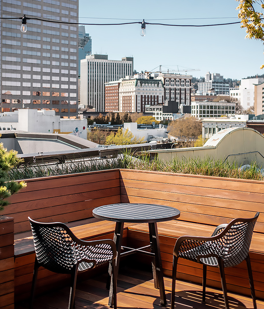 On the rooftop bar of the hotel looking out over the city.